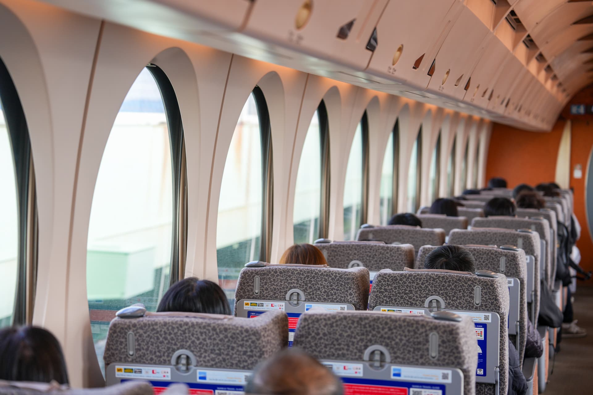 Rapi:t cabin interior — round porthole windows along the row