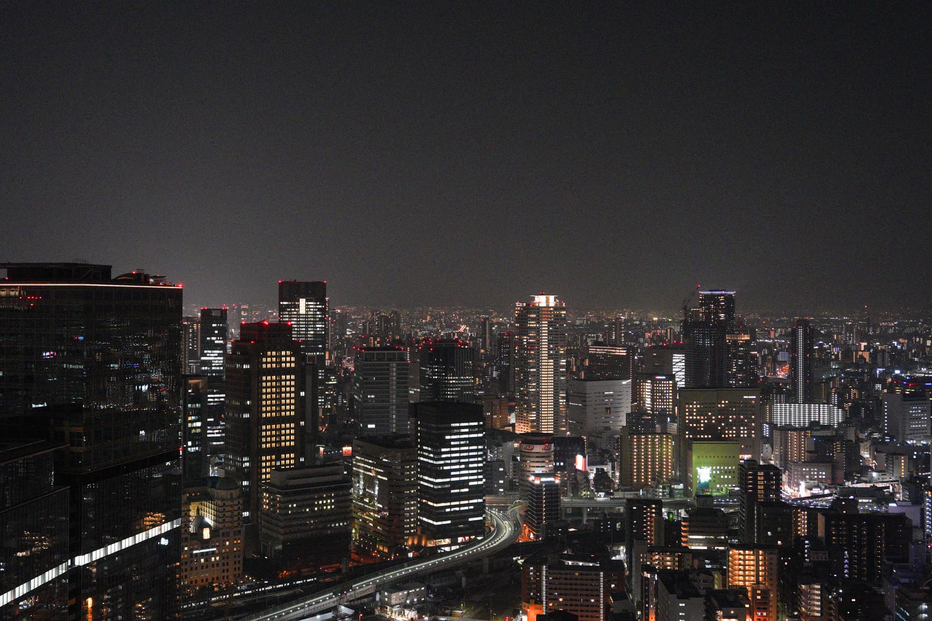 Dense downtown night view from Umeda Sky Building