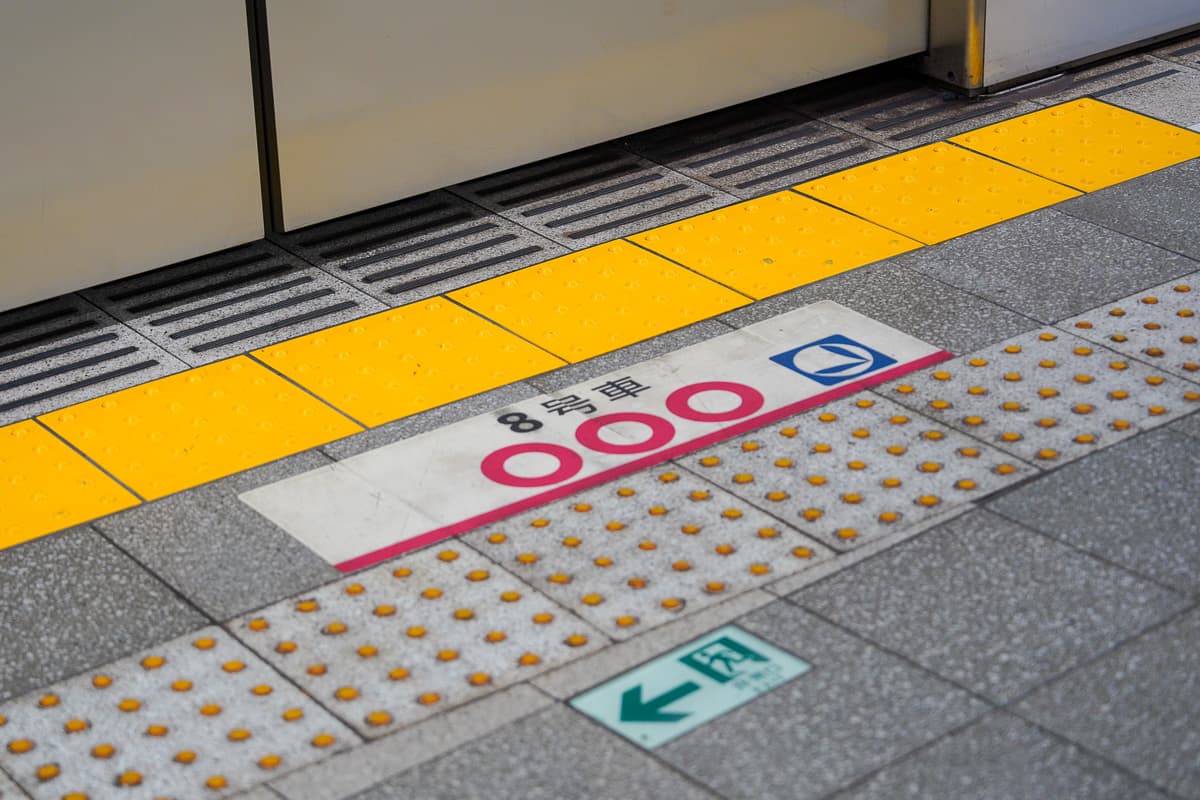 Floor markings showing where to queue at Tokyo subway platform