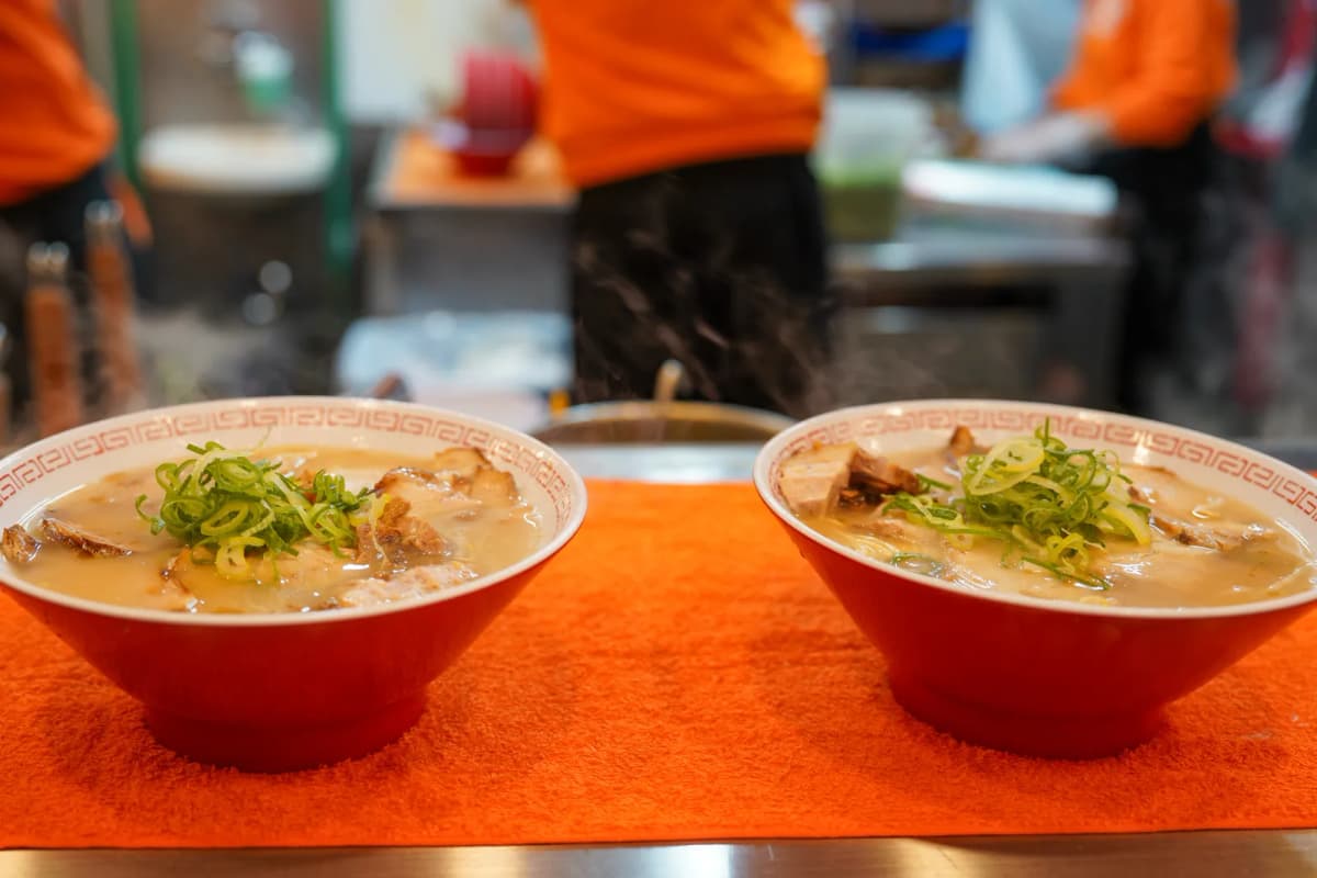 Two bowls of ramen on the counter at Kinryu Ramen Dotonbori