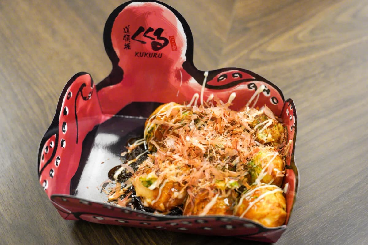Takoyaki in an octopus-shaped tray from Kukuru Dotonbori Minami