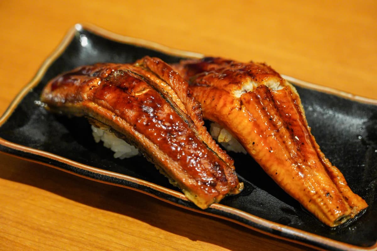 Two pieces of grilled eel nigiri at Uoshin Minami