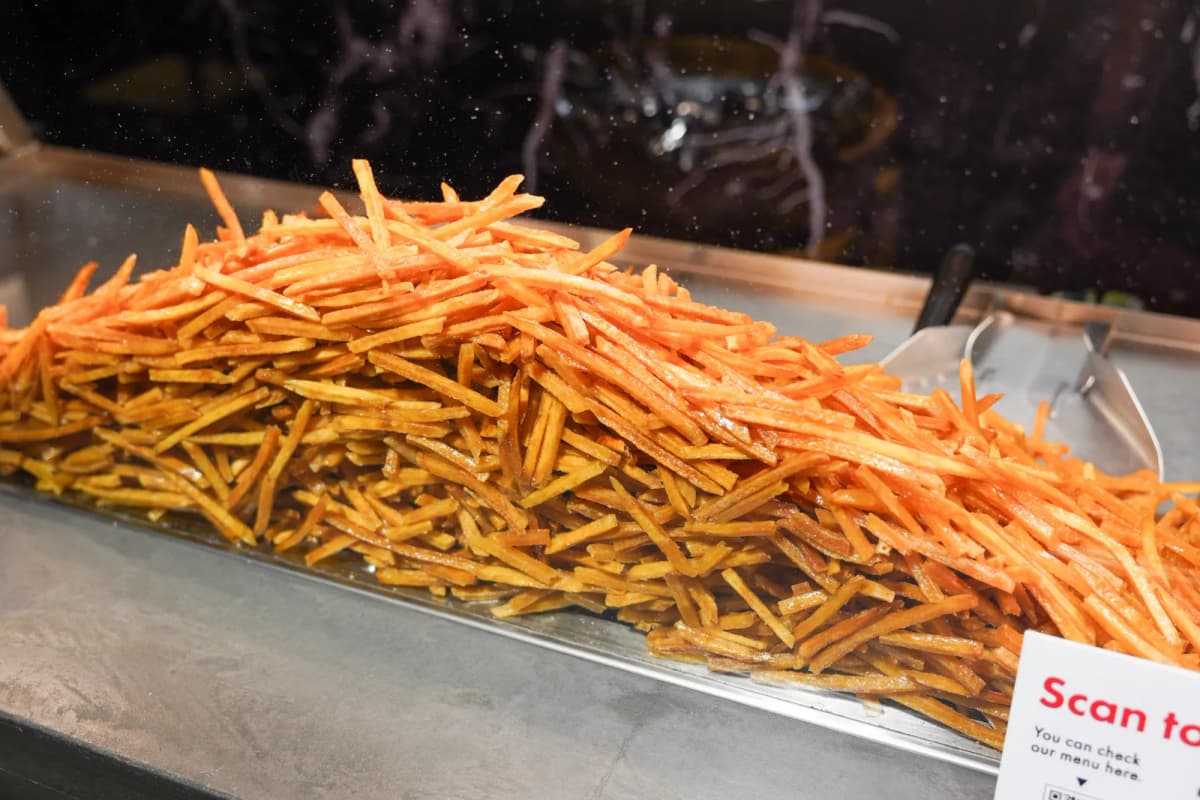 Thin sweet potato fries piled up at Imoya Kinjiro